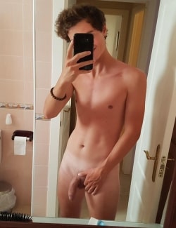 Nude boy in the mirror