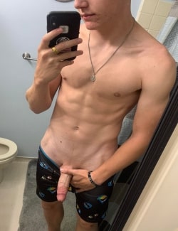 Shirtless boy with a shaved cock